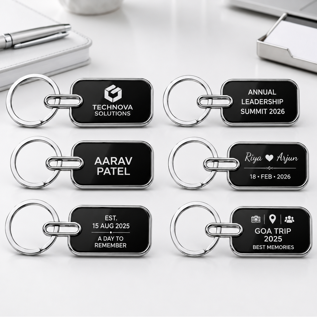 Set of personalized keychains with engraved text on a desk with office supplies.