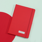 Closed red personal diary showing smooth cover texture for custom printing.
